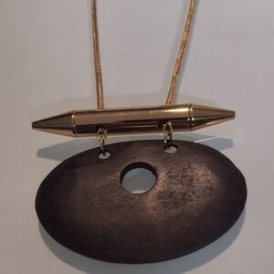 mark. Gold and Black Pendant Necklace